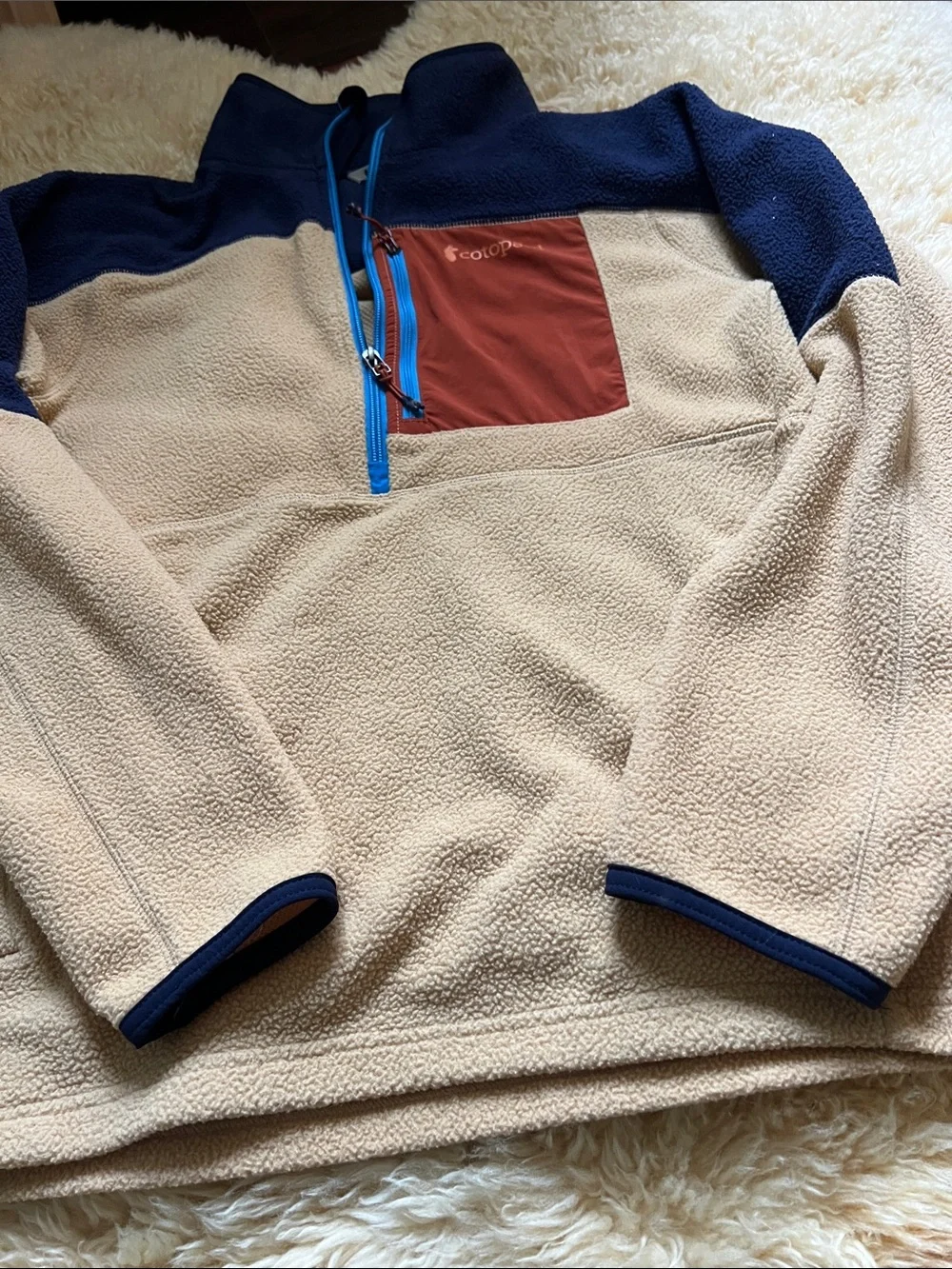 Cotopaxi Men’s Tan and Navy Fleece Half-Zip with Rust Chest Pocket